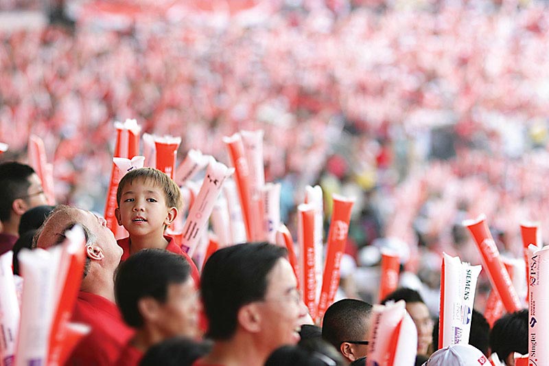 John smiling in the crowd during the Singapore National Day Celebration